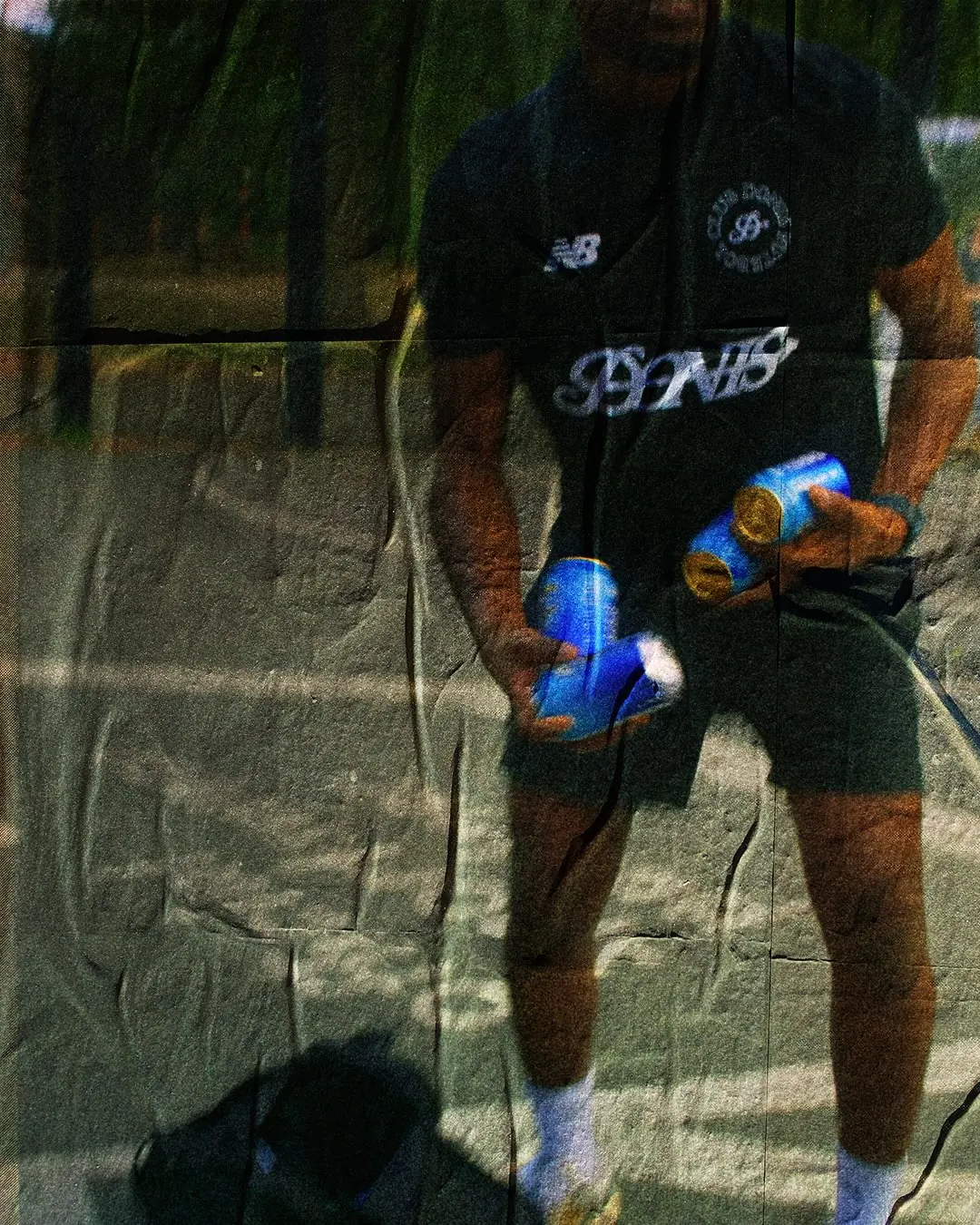 A player in the black Donis kit